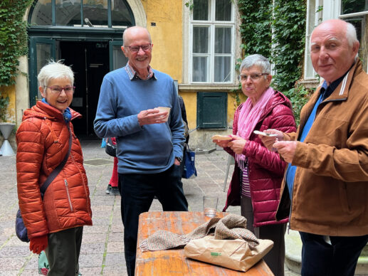 members in courtyard fellowshipping